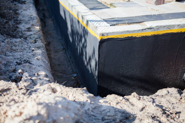 Professional Waterproofing technician working in Adelphi, OH